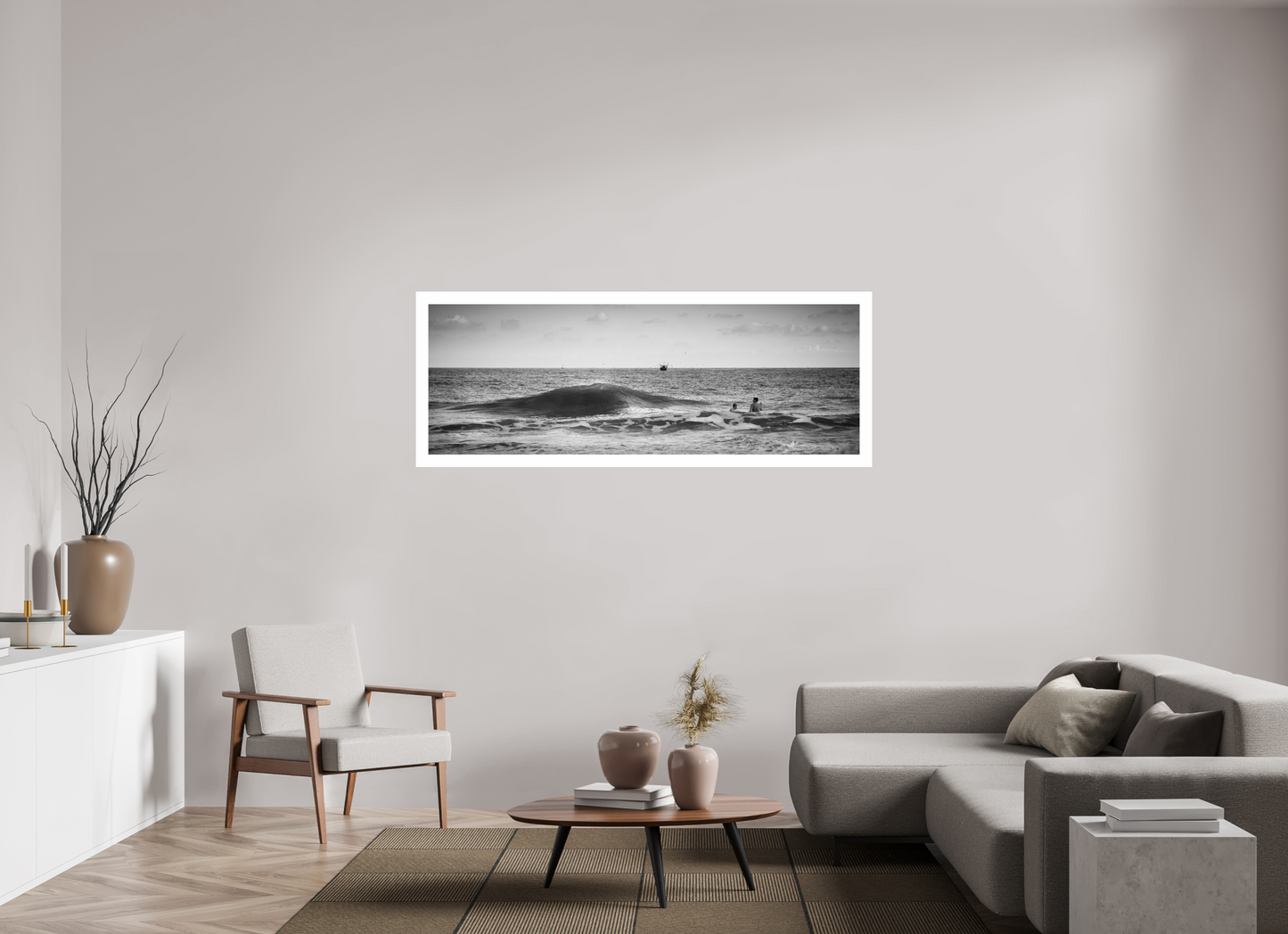 People swimming in the sea with a wave crashing and a fishing boat on the horizon