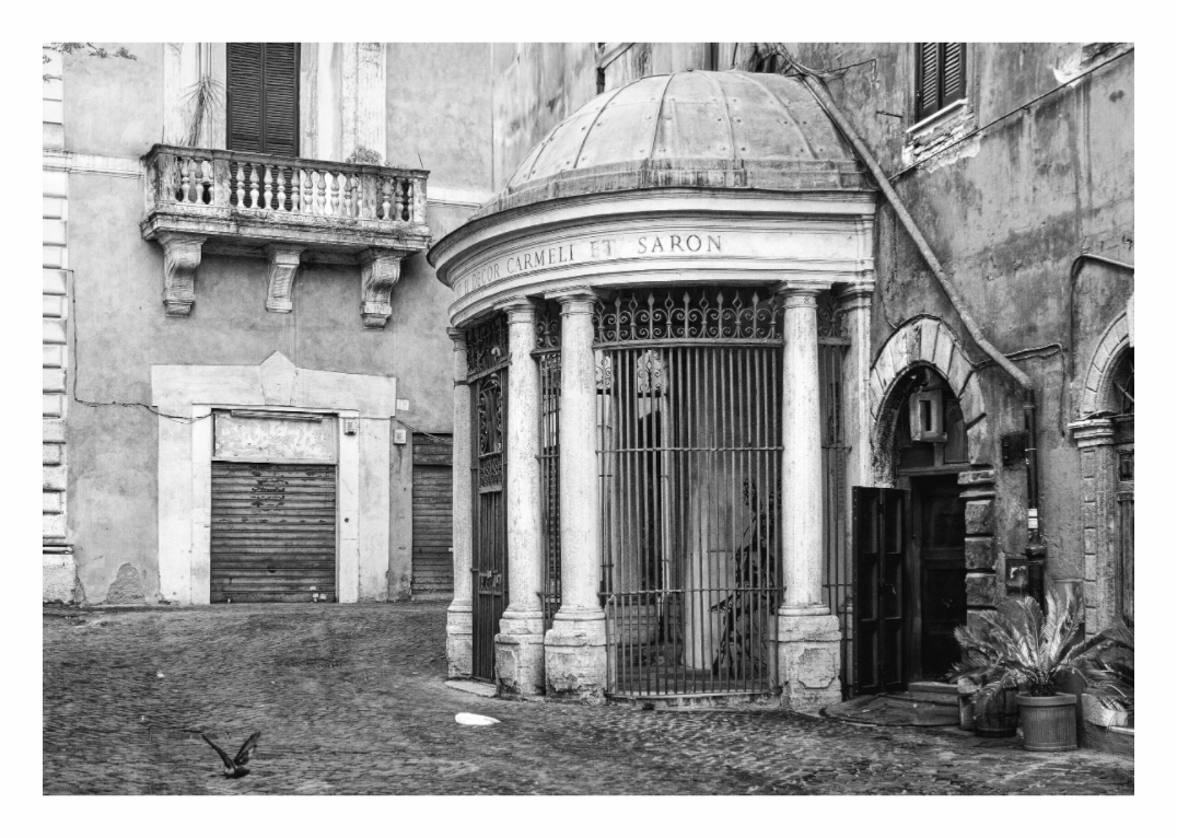 Black and white architectural scene with a domed structure and columns. Black and white street photography print of a historic square in the Trastevere neighborhood of Rome, Italy, capturing architectural detail and daily life.