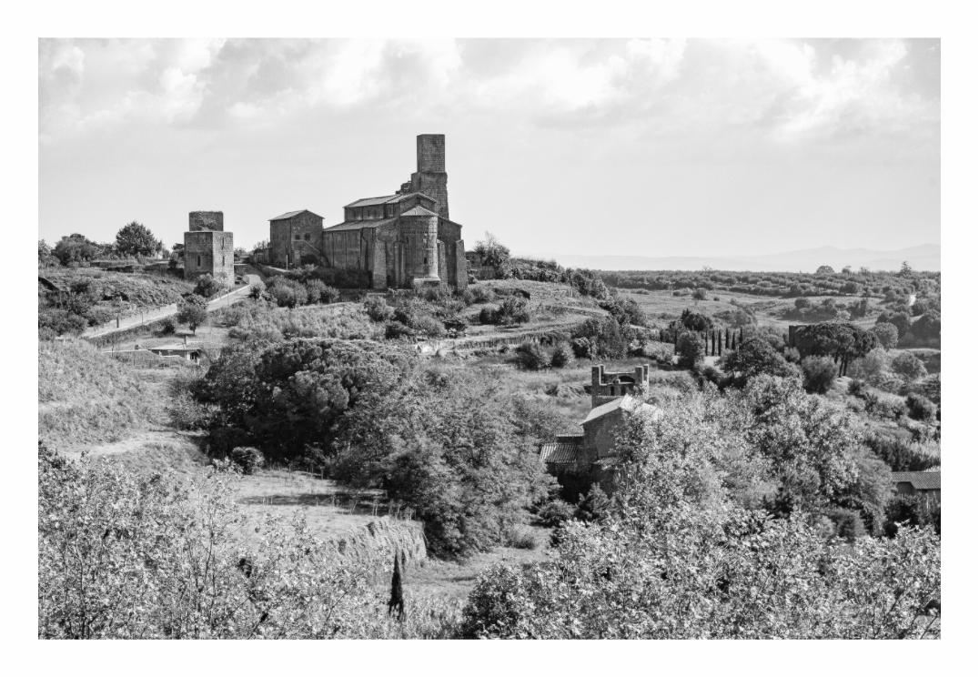 Historic monastery on a hill with surrounding landscape, Monochrome landscape print of the historic stone Etruscan monastery in northern Lazio, Italy.