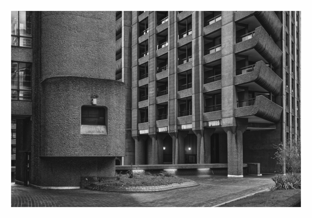 Monochrome image of a modernist building with geometric design, Monochrome photo highlighting the sharp lines and textured concrete of the Barbican Centre complex.
