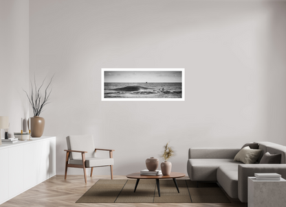 People swimming in the sea with a wave crashing and a fishing boat on the horizon